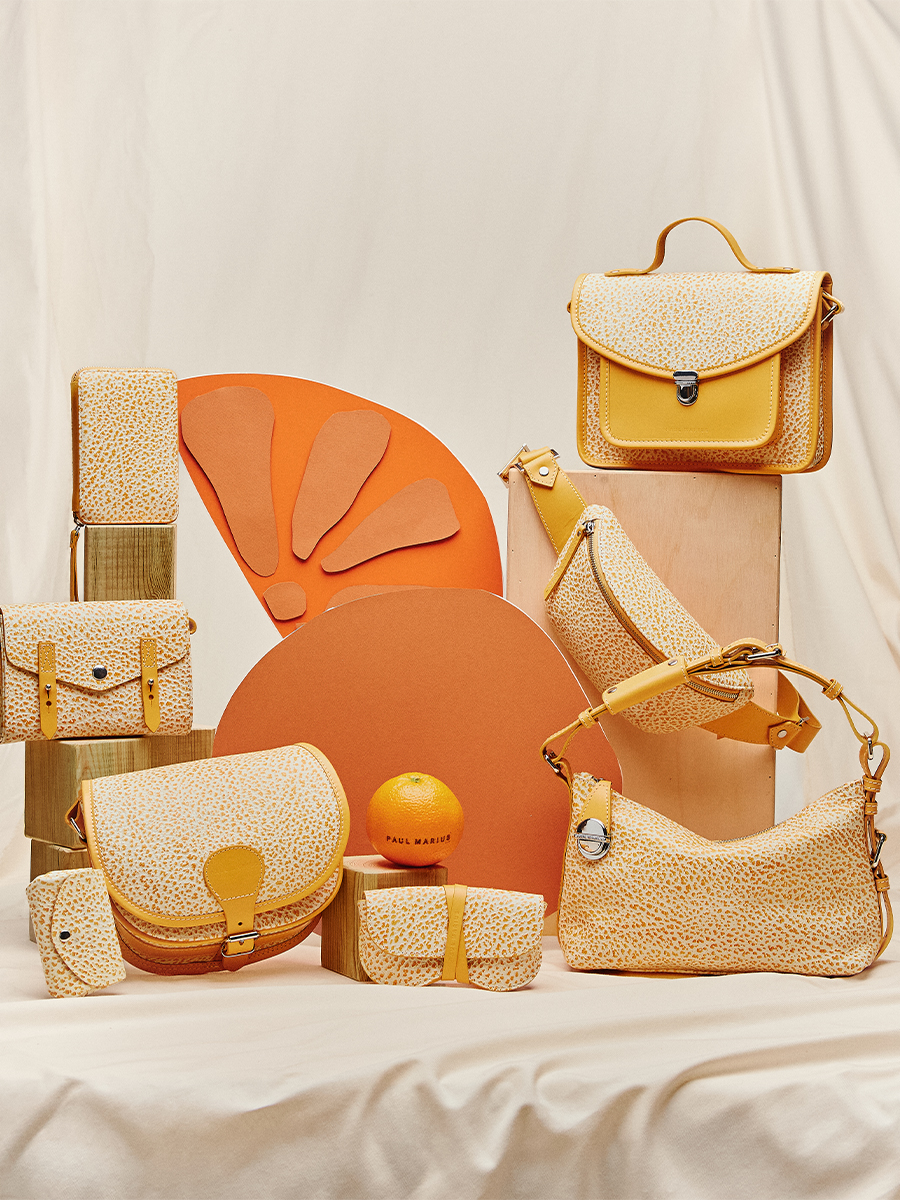 Small orange leather crossbody bag LeMini Indispensable - Orangeade ambient view